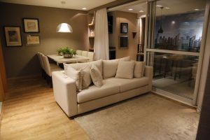 Cozy living room with modern furniture and dining area, perfect for stylish home interiors.