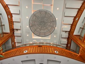 Captivating view of modern architecture featuring a large circular ceiling design with elegant lighting.